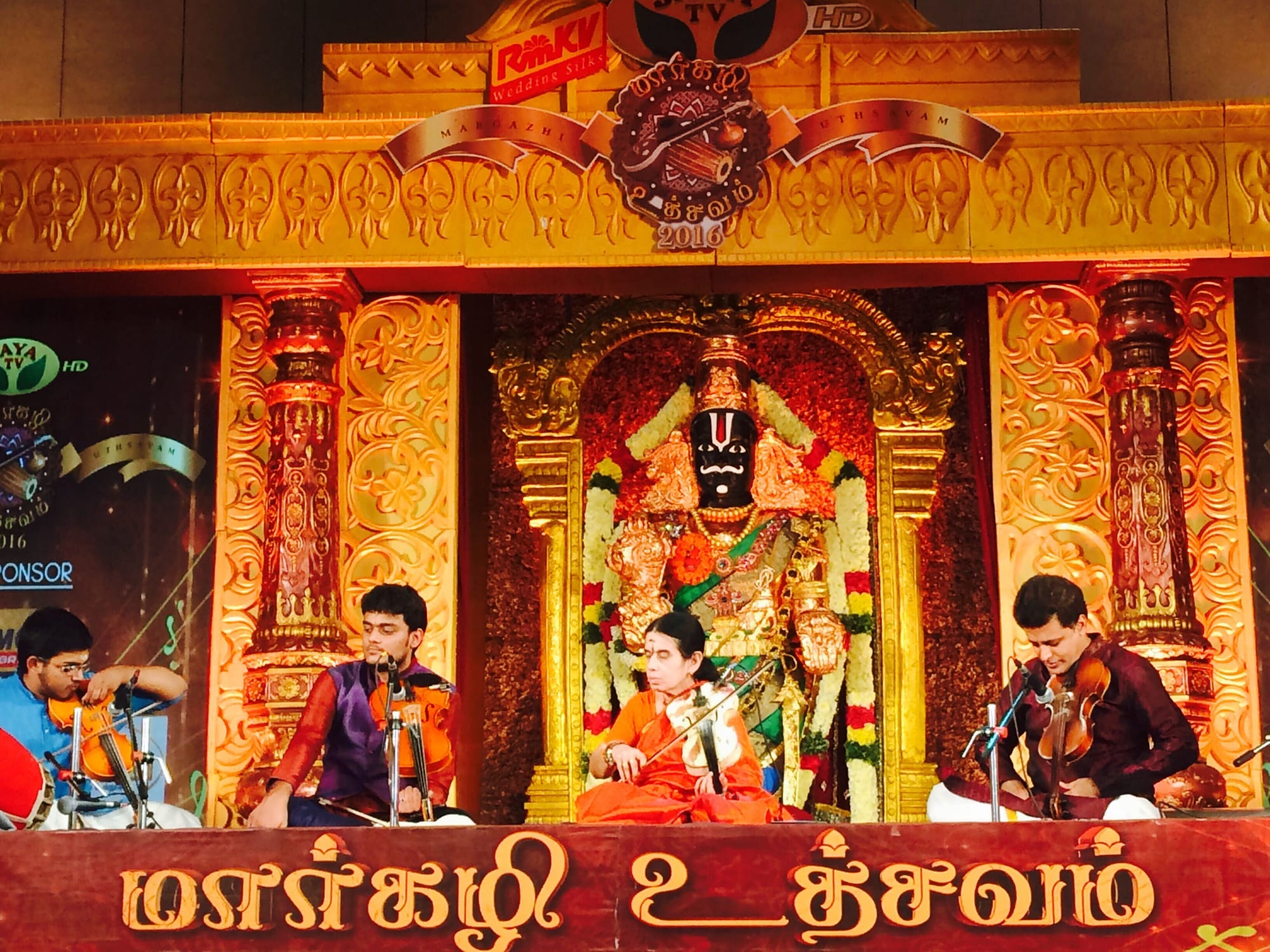 Playing in a violin ensemble at Jaya TV’s Margazhi Utsavam 2016, before an ornate temple-style stage